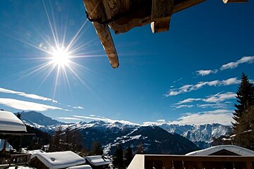 a picture of a sunny view from the balcony of an apartment