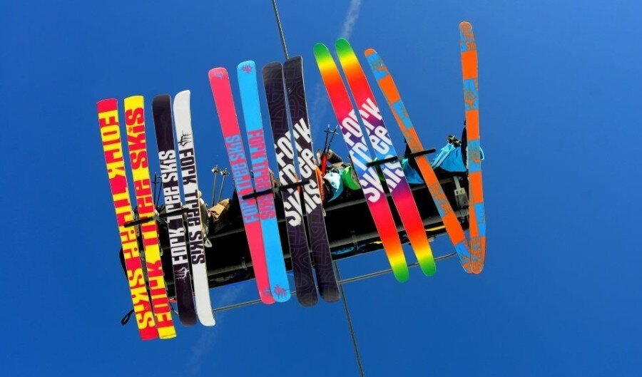 underside of fork tree skis on chairlift