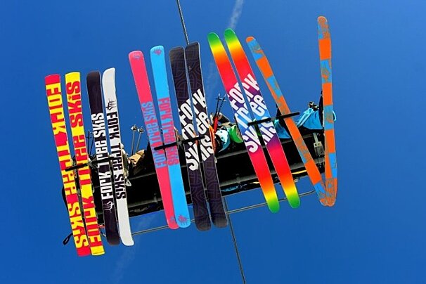 underside of fork tree skis on chairlift