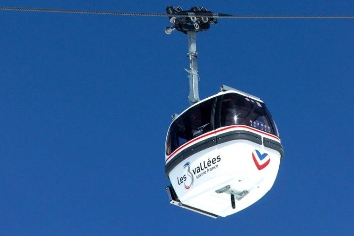 an image of blue sky and 3 valleys gondola