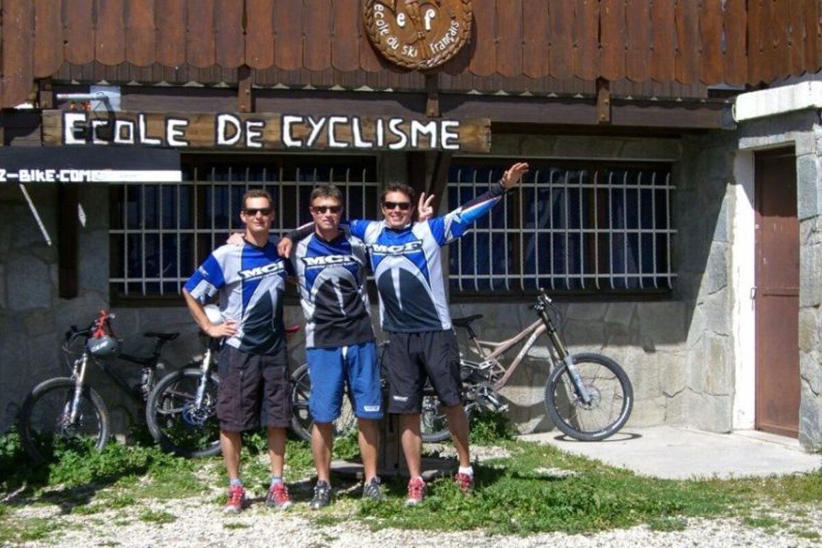 a picture of 3 mountain bike coaches