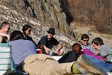 an image of people hanging out near climbing wall