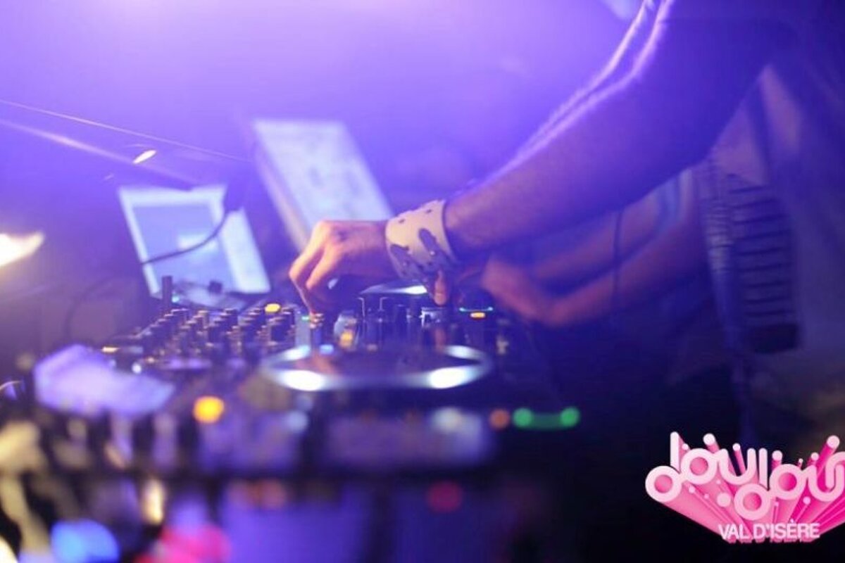 a picture of a dj on the mixing desks