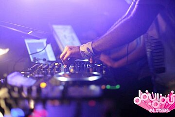 a picture of a dj on the mixing desks