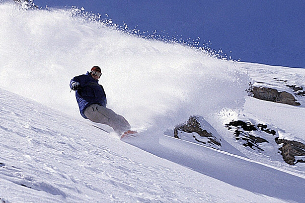 a picture of a snowboarder riding off piste
