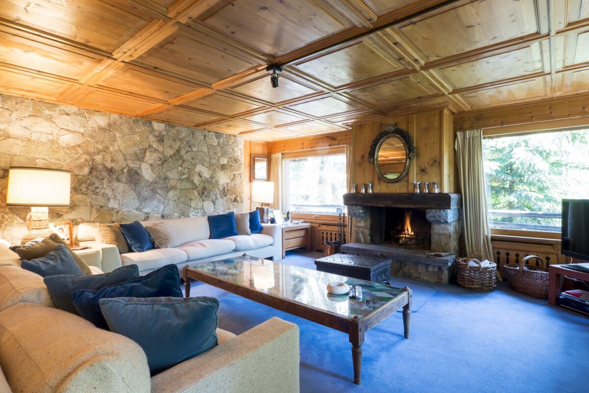 A living room with a fireplace and a couch