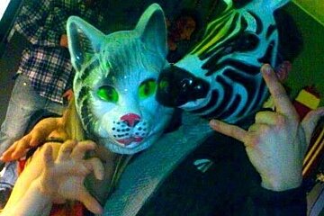 an image of people wearing animal masks