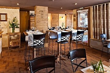 A dining room with tables and chairs and a sign that says ' a ' on it
