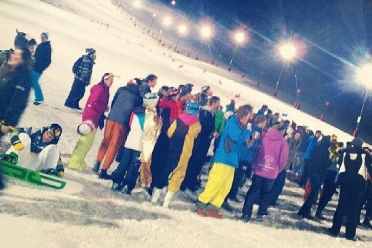 a group of people going night skiing