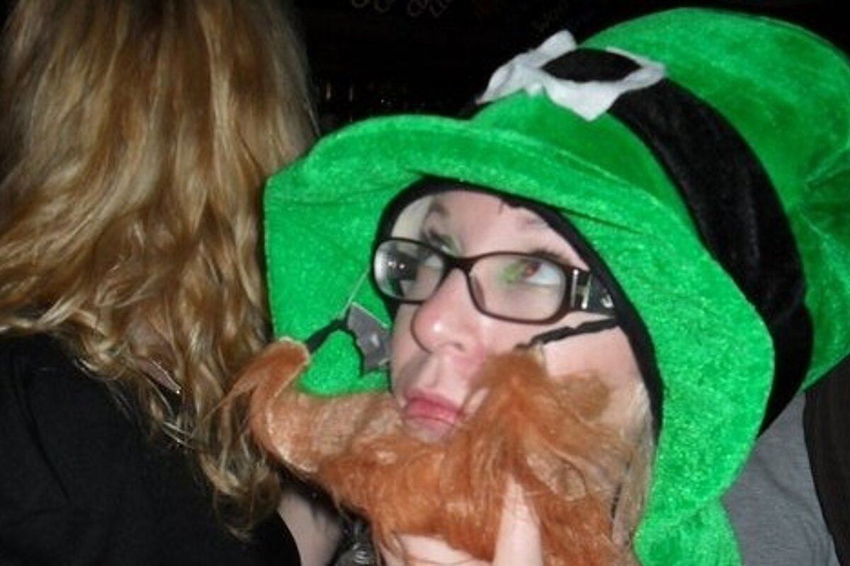 an image of a girl with a leprechaun hat