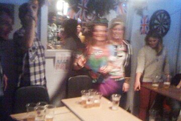 an image of people playing beer pong