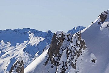 an image of candide thovex hiking up with skis in verbier