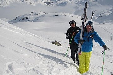 walking uphill with skis