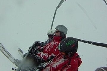 an image of people freezing on a chairlift