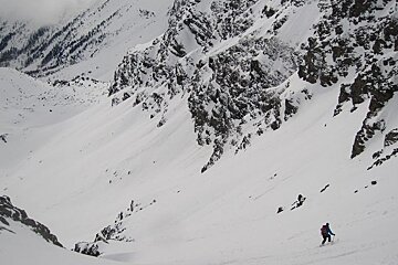skier in a steep couloir