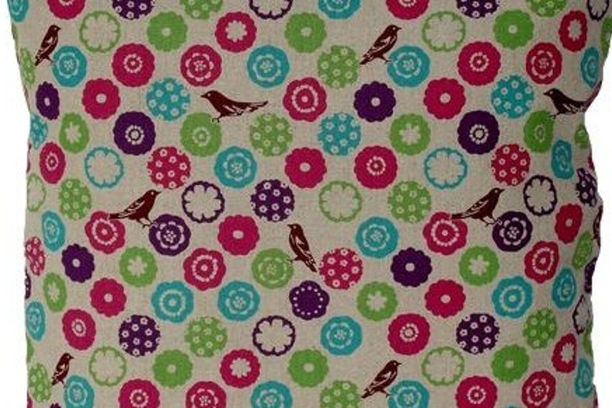 a picture of a cushion with a pattern with birds on 