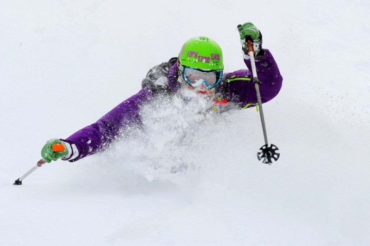 an image of a skier in very deep powder snow