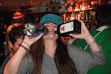 downing drinks out of bottles