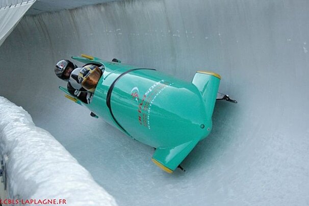 people going down a bobsleigh track