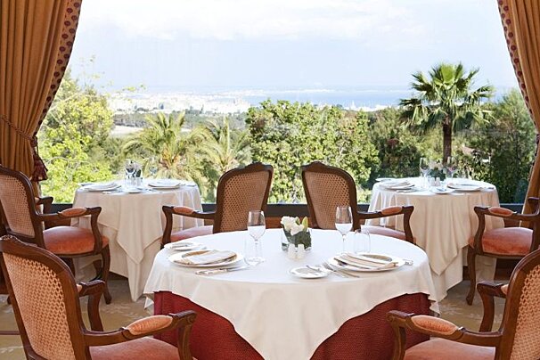 photograph of a dining room with view of bay of Palma