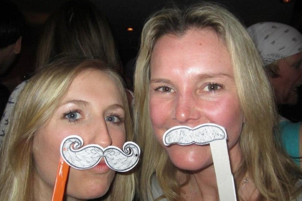 an image of girls with fake moustaches