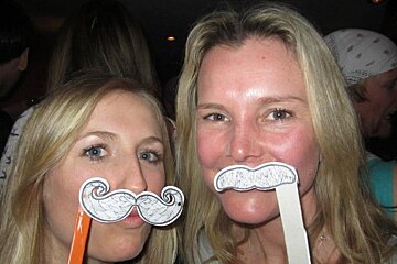 an image of girls with fake moustaches