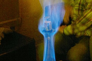 an image of a drink on fire