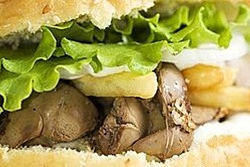 a picture of a posh burger with mushrooms and lettuce