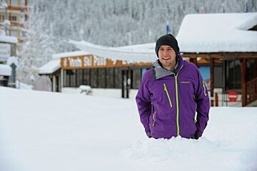 man up to waist in snow