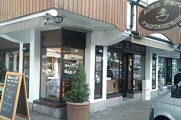The outside of a restaurant called alan peru