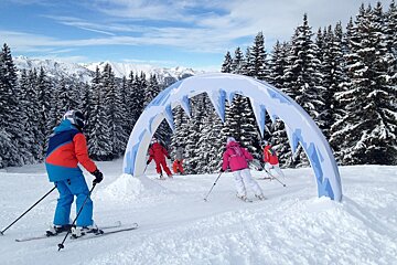 a poster showing a new children's ski area in meribel