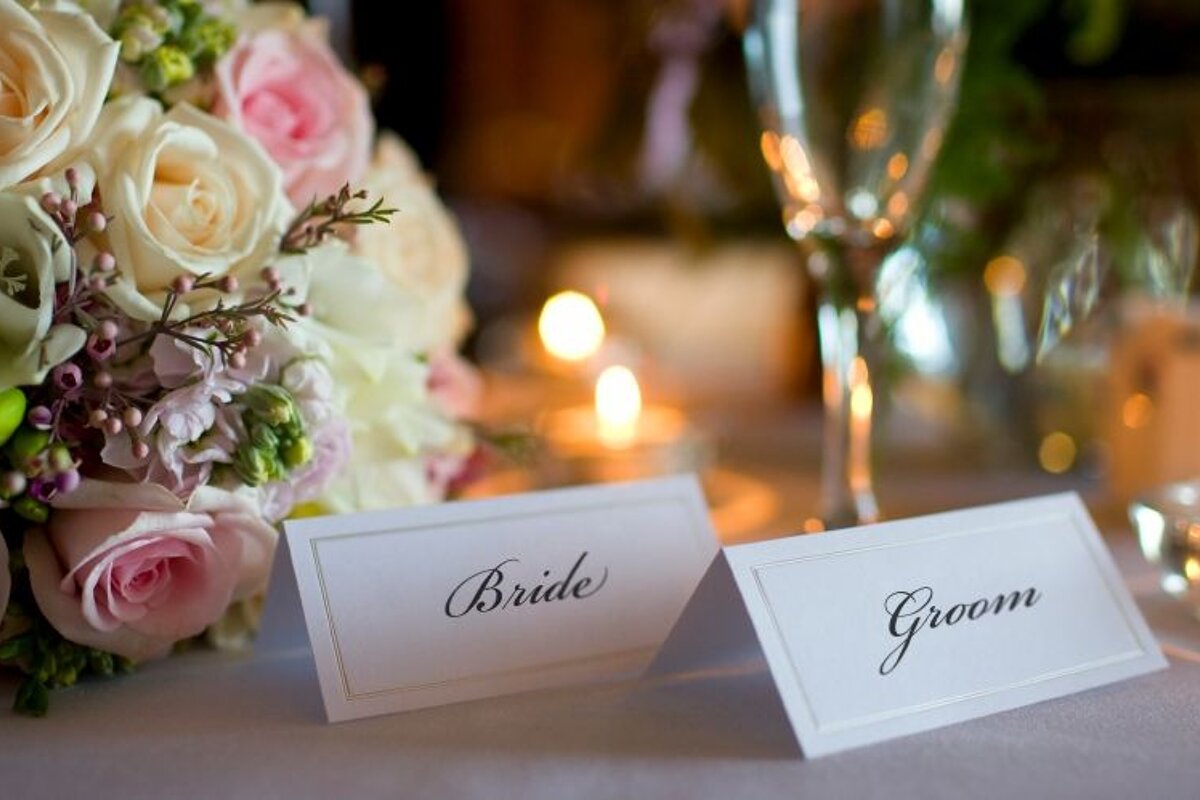 a picture of a bridal posey and bride and groom name tags