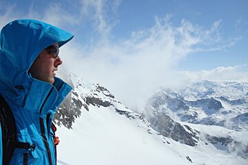 man overlooking mountains