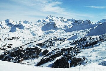 an image of mountains and sun la plagne