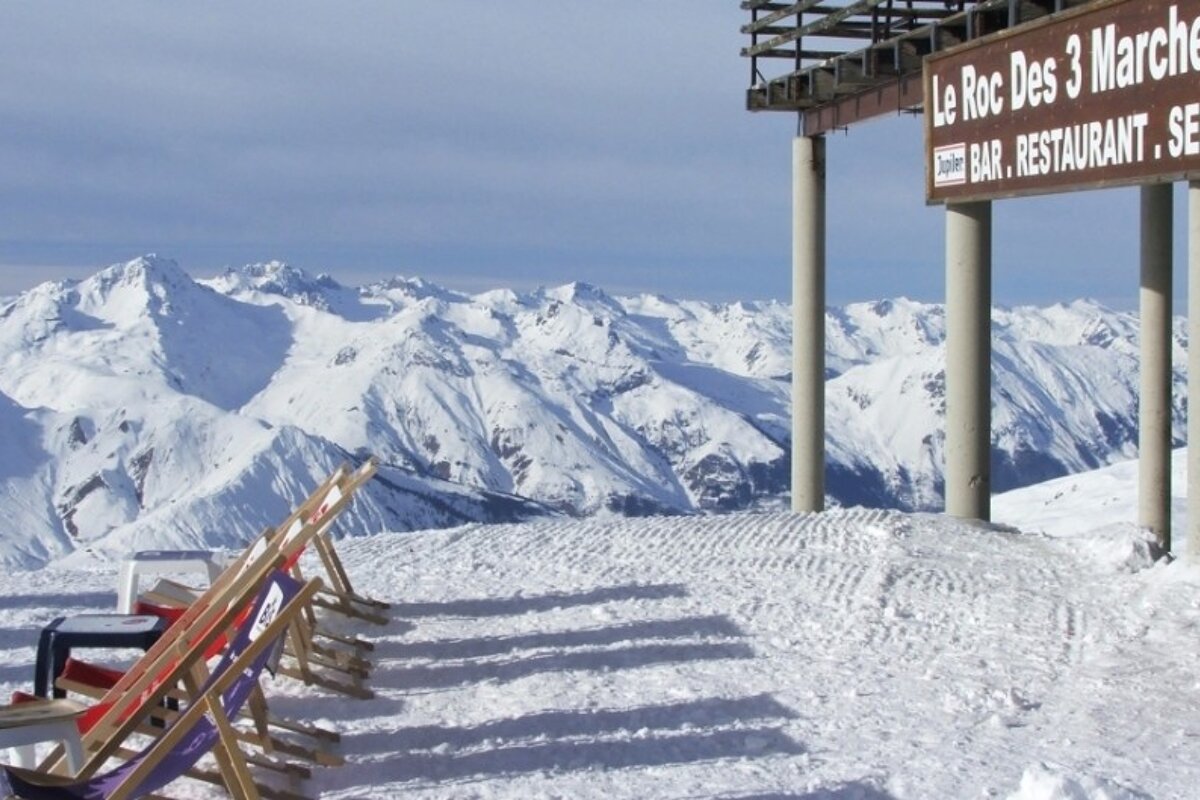 an image of deckchairs outside le roc des 3 marches val thorens