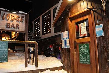 An image of a ski resort restaurant and apres-ski bar in snow in winter in Val d'Isere