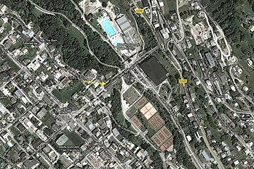 image of a satellite map with a yellow arrow pointing to a destination