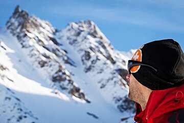 an image of a man looking side on at the mountains