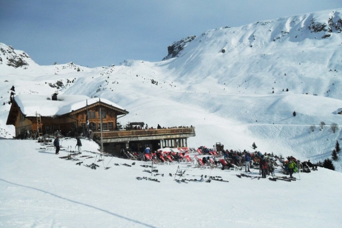 an image of a mountain restaurant and deckchairs