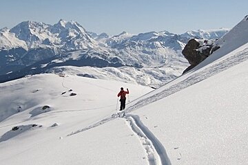 mountain guide off piste with panorama