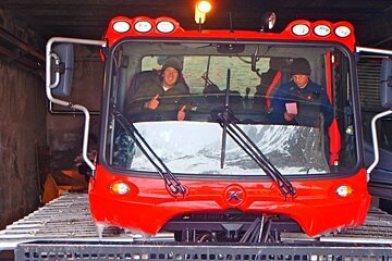 an image of people in a piste basher