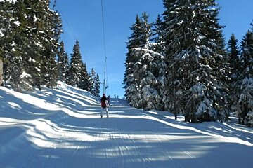 an image of skiing on a lift