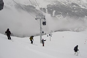 skiers in powder