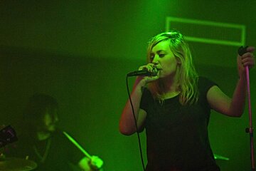 an image of a girl with a microphone