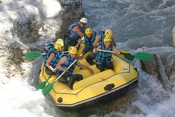 Raft with 7 people in white water