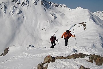 Mountain guide climbing with client