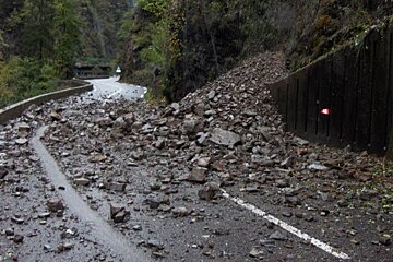 tonnes of rock blocking the road in a gorge near chamonix