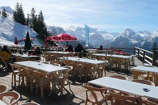 an image of a terrace at a restaurant with a nice view in a ski resort
