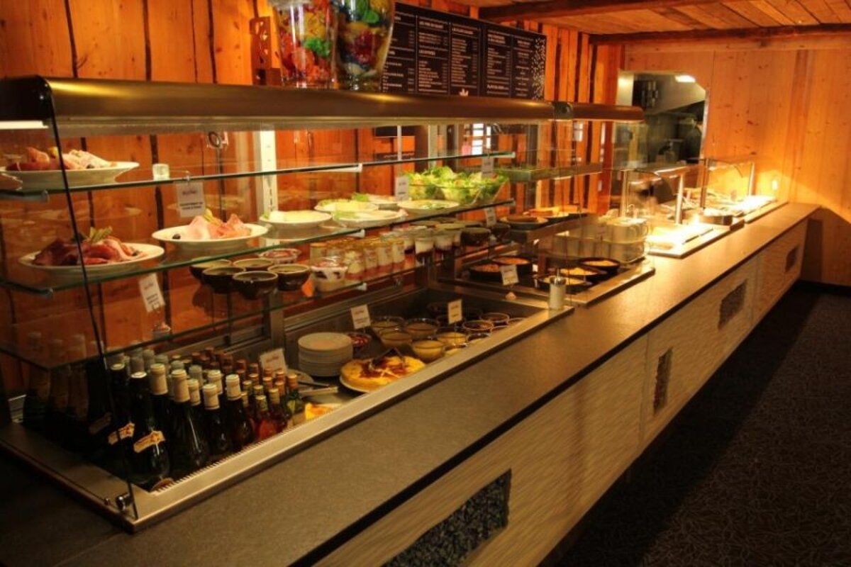 A buffet line with a sign that says ' buffet ' on it