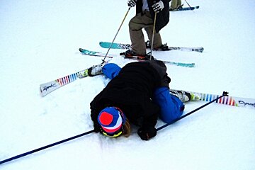 an image of a skier flat out on the piste